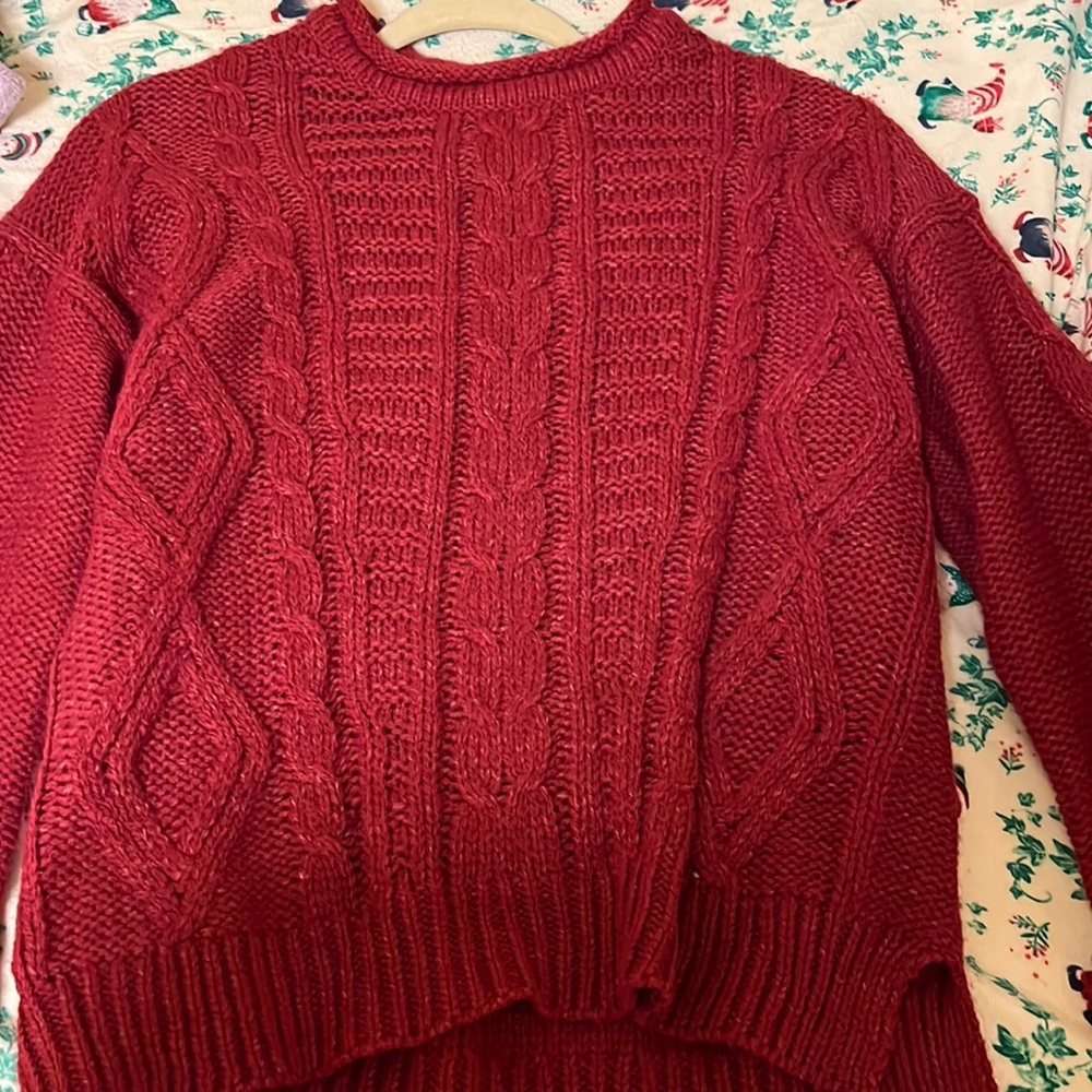 dark red cable king sweater with small side slits